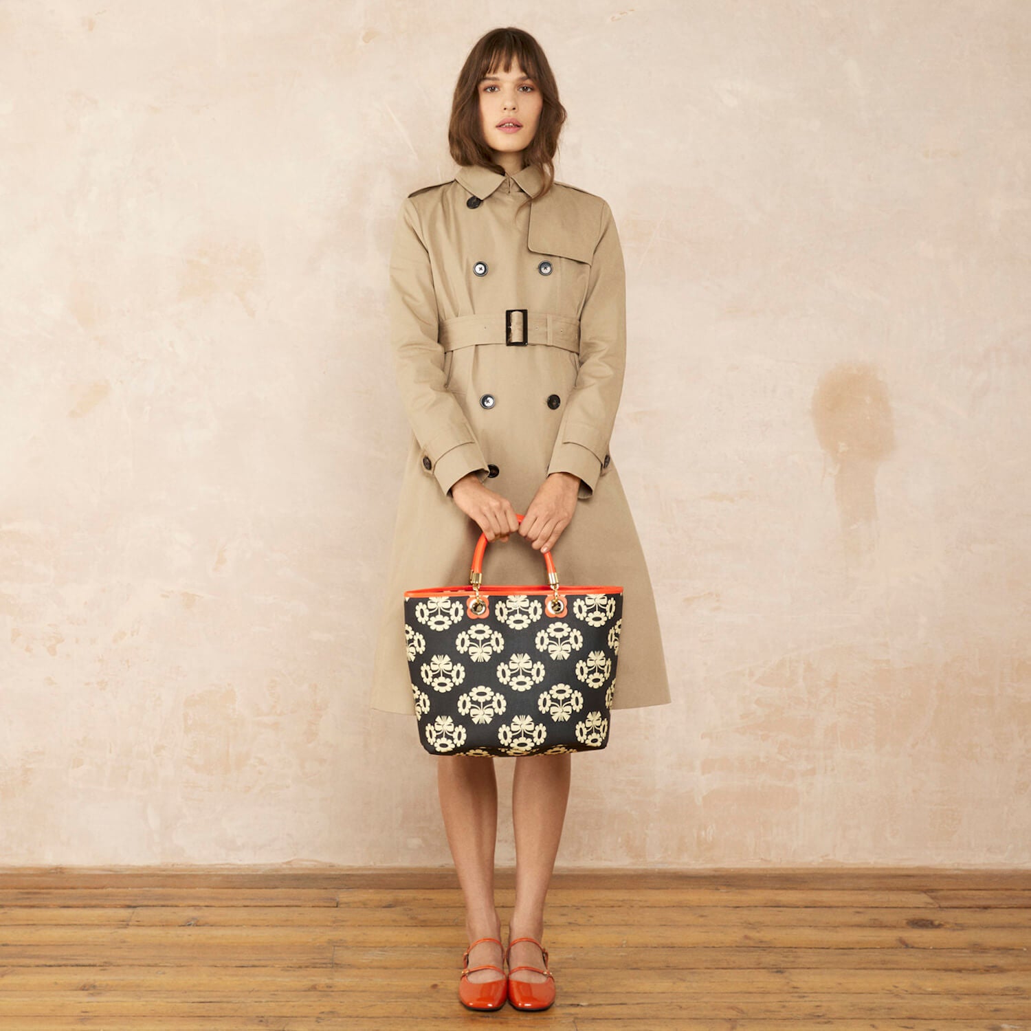 Model wearing the Smile Tote Bag in Posey Flower Midnight pattern by Orla Kiely
