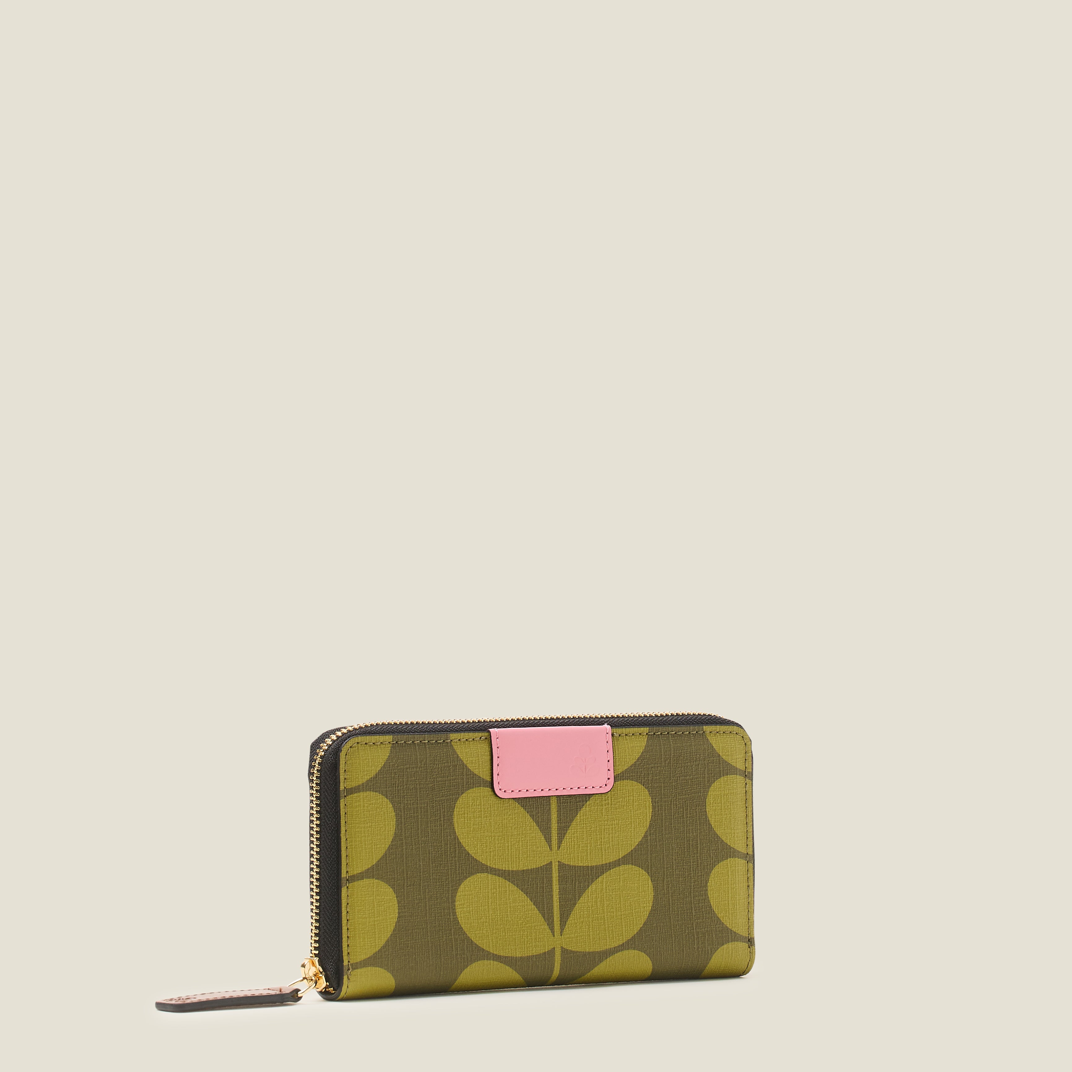 Side view of the Orla Kiely Forget Me Not Wallet in olive green stem print, with zip closure and pink leather trims.