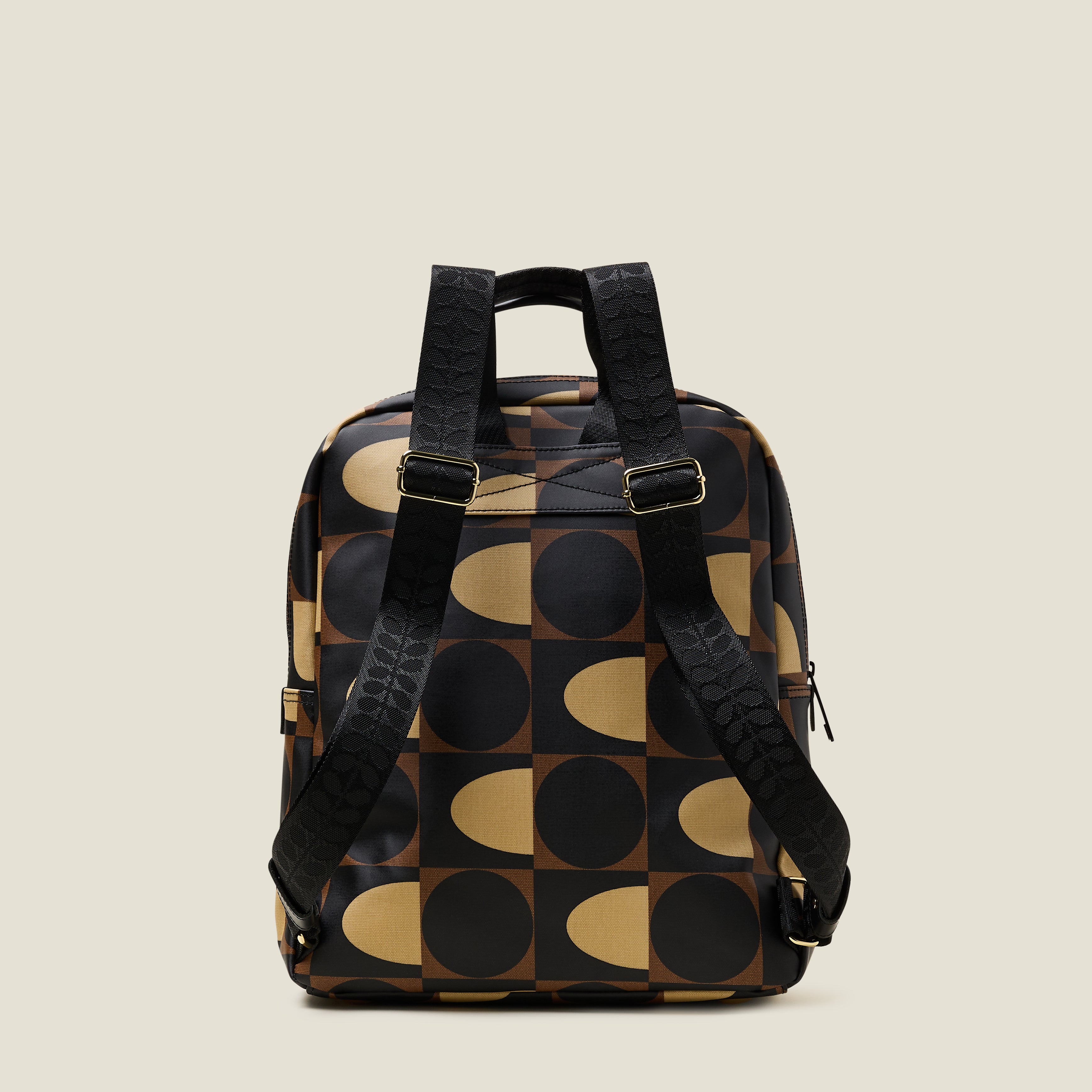 Back view of the Lotta Backpack in a brown print featuring branded adjustable shoulder straps.