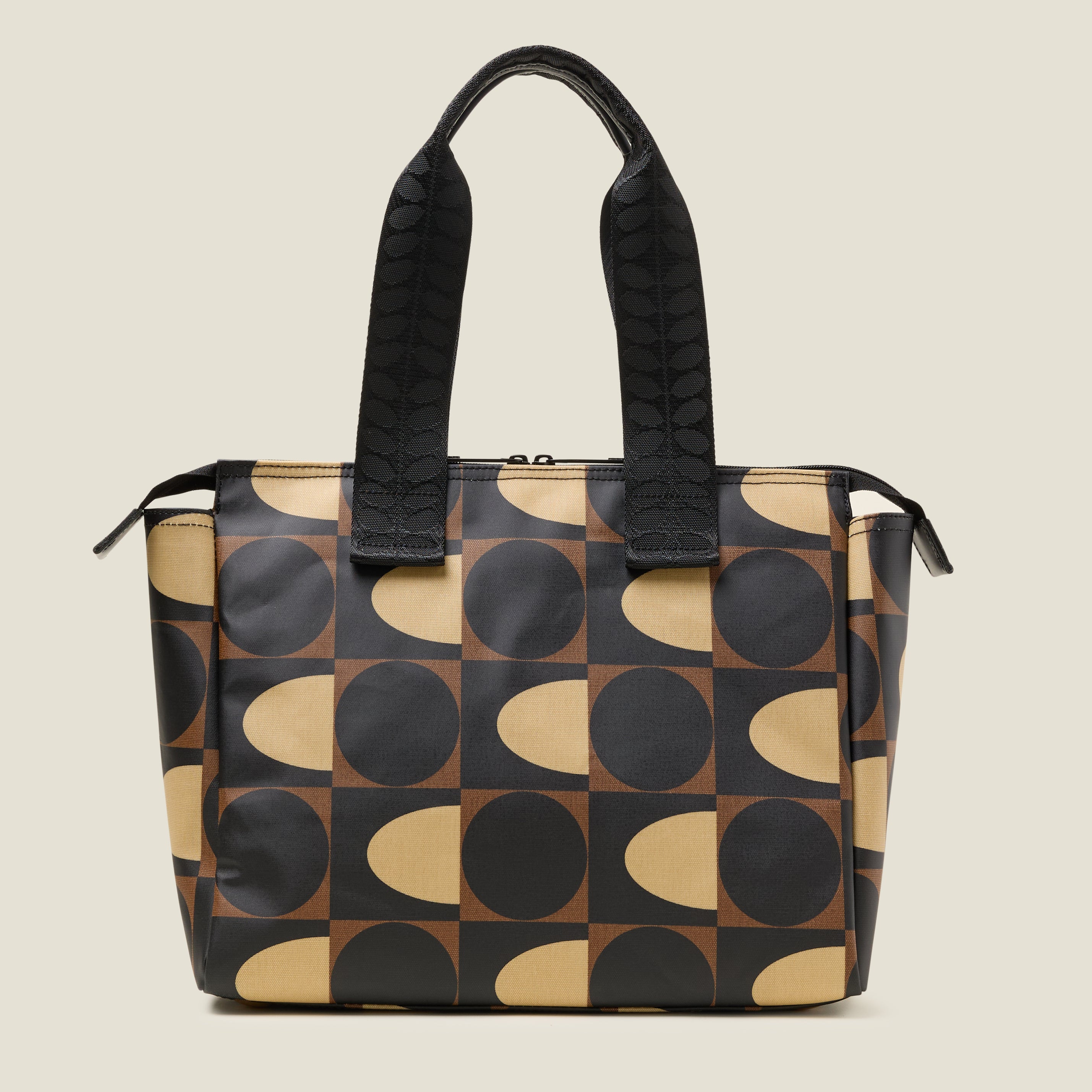 Back view of a brown, black and cream patterned tote bag with branded grab handles
