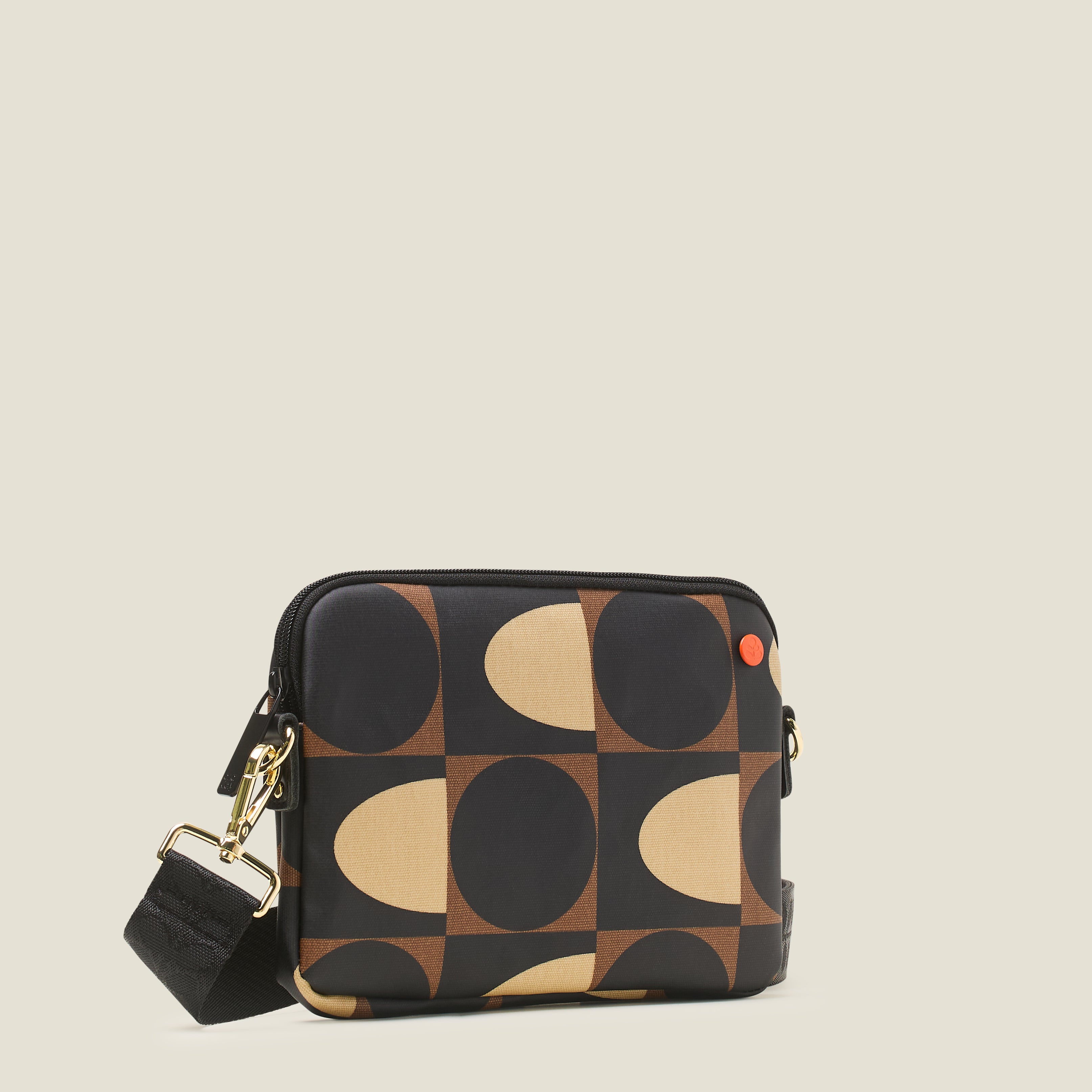 Side view of the Slim Crossbody Bag in a brown, cream and black coated cotton with detachable shoulder strap.