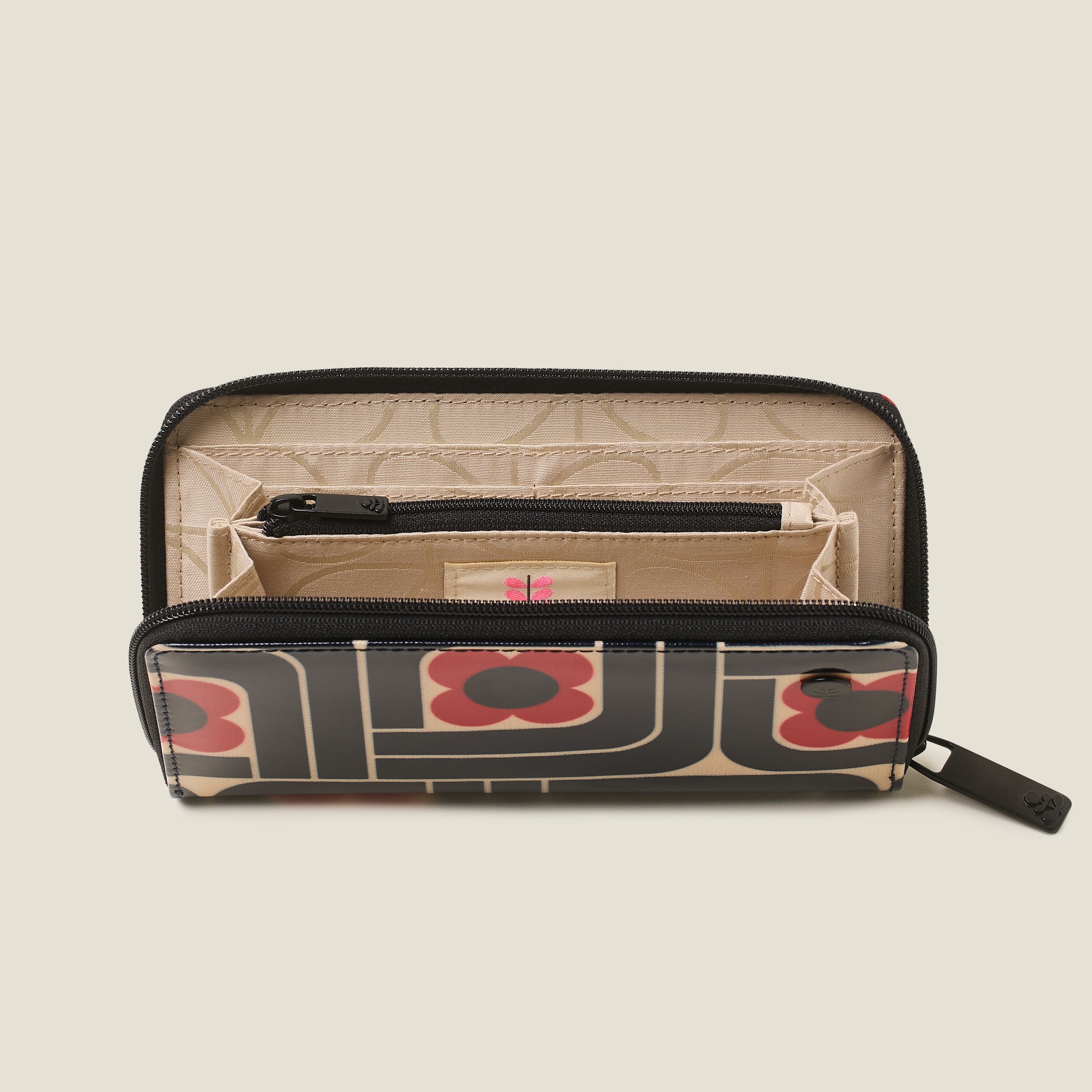 Open inside view of the Forget Me Not Wallet with card slots and zip internal pocket and branded lining.