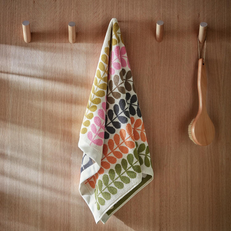 Lifestyle shot of Orla Kiely multi stem towel hanging up