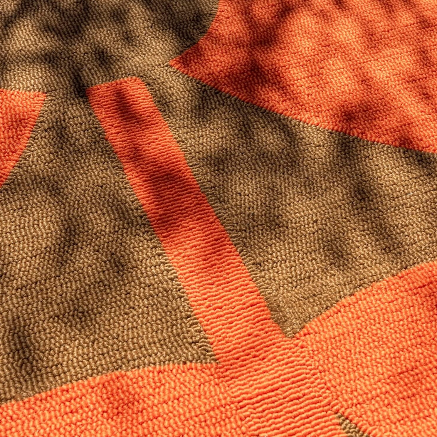 Close up of Giant Sixties Stem tomato orange Rug by Orla Kiely