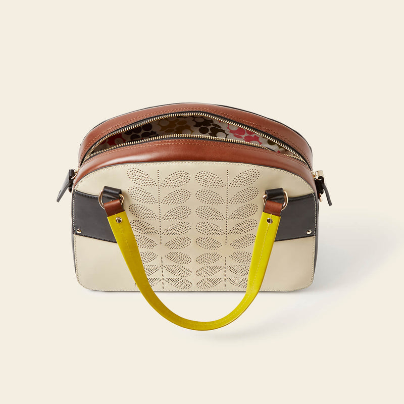 Luna Bowling Bag in Cream Punched Flower pattern by Orla Kiely