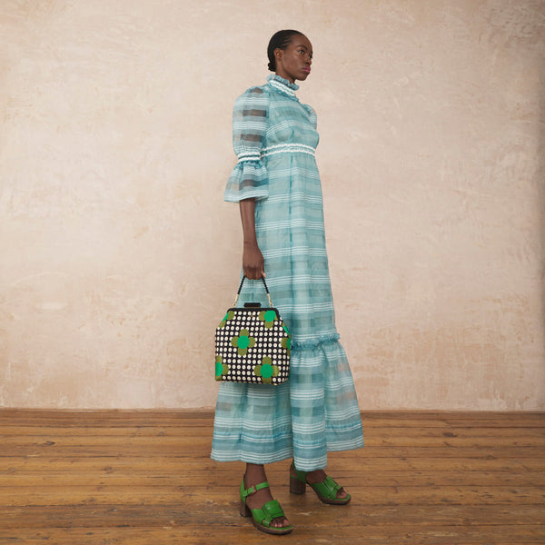 Model wearing the Jenny D Handbag in Jewel Flower Polka Dot pattern by Orla Kiely