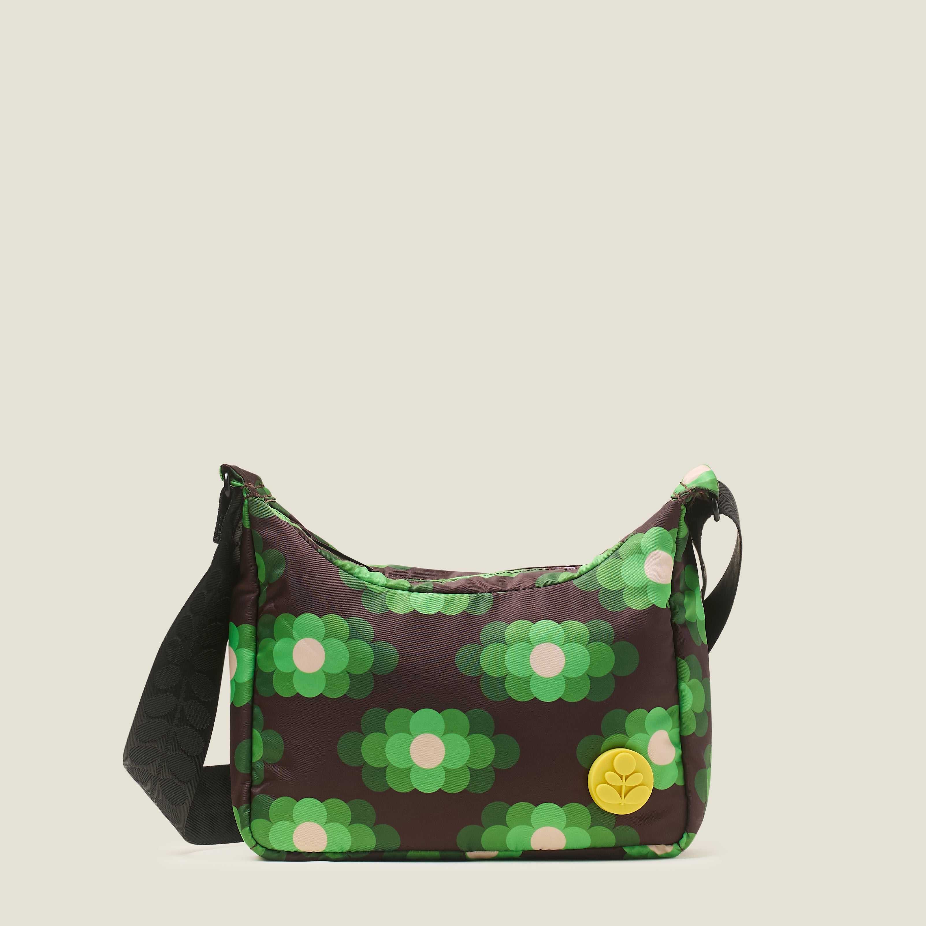 The front view of small hobo bag with neon green floral pattern, yellow stem logo branding and black adjustable strap.