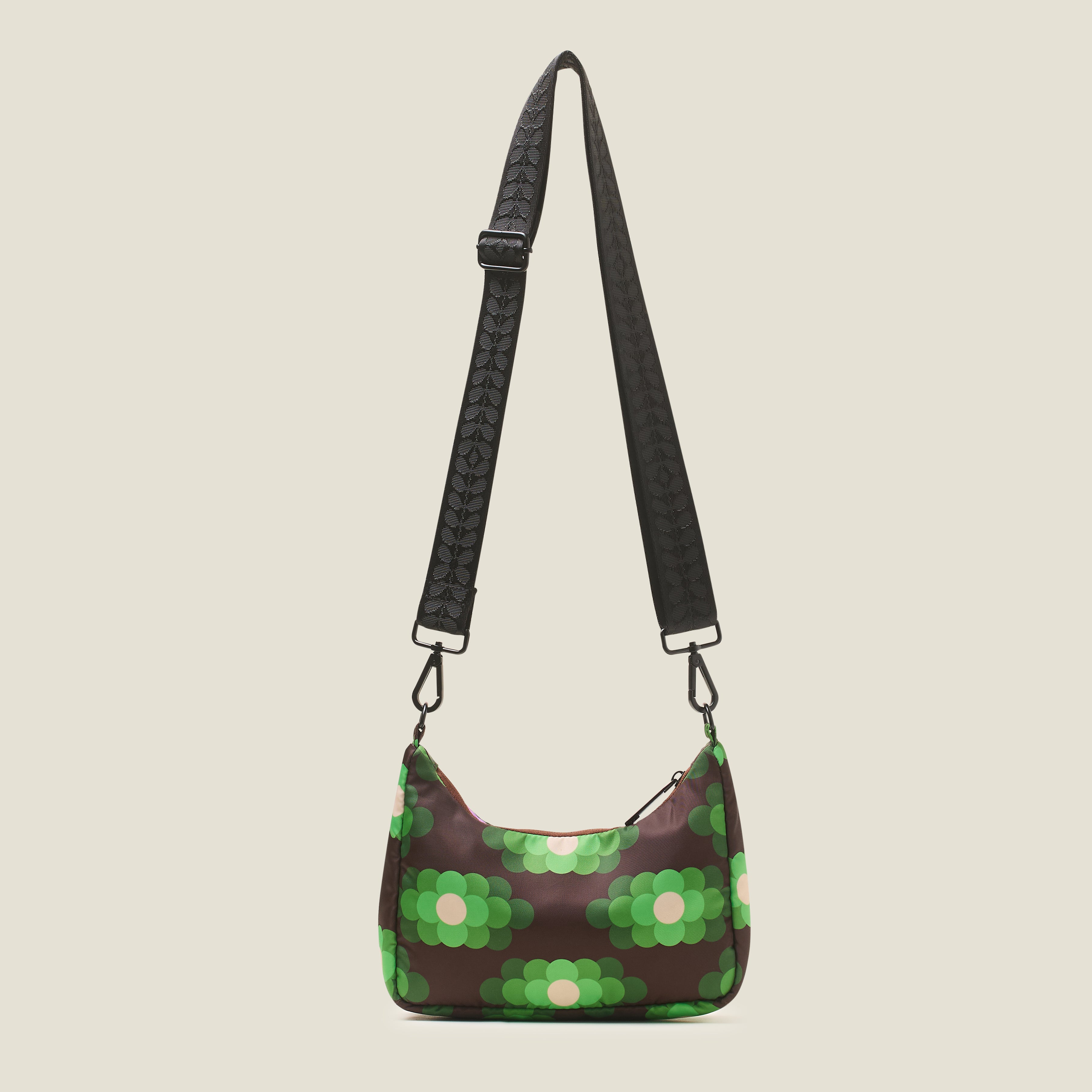 Crossbody strap on the back view of the Venn crossbody bag with neon floral retro print.