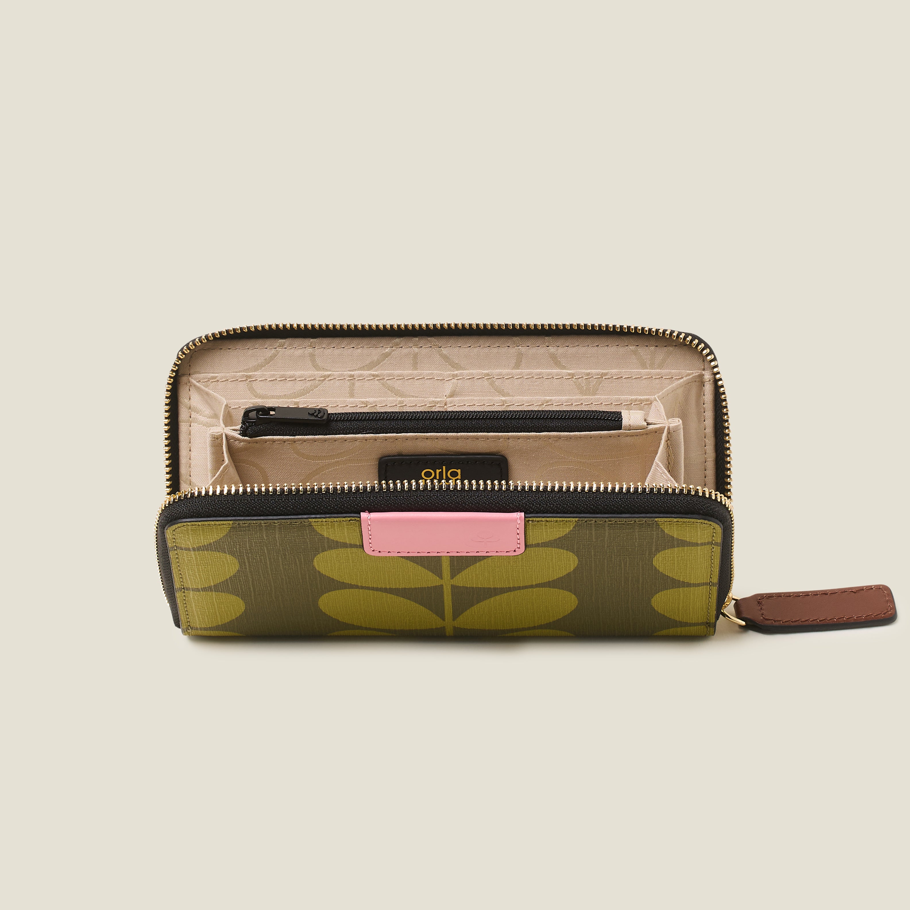 Open view of the Orla Kiely Forget Me Not Wallet in olive green stem print, with inside zip pocket, cards slots, zip closure and pink leather trims.