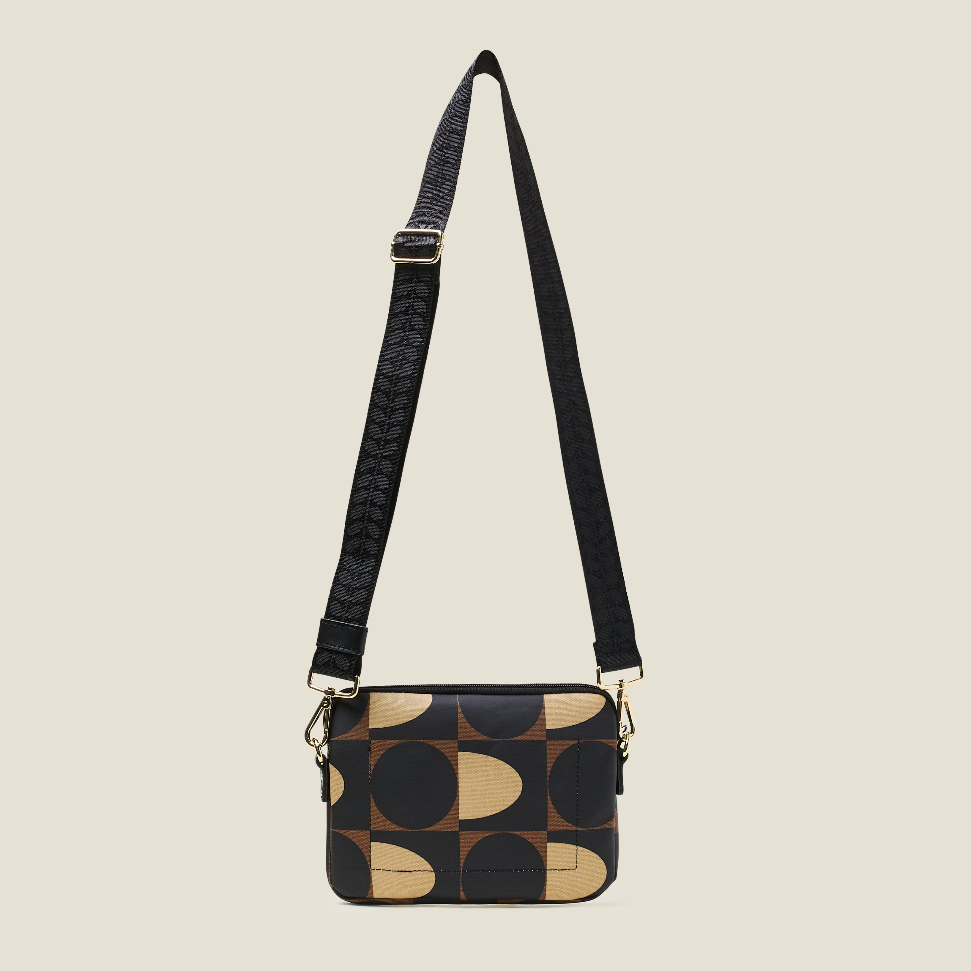 Back view of the Slim Crossbody Bag in a brown, cream and black coated cotton with detachable shoulder strap.