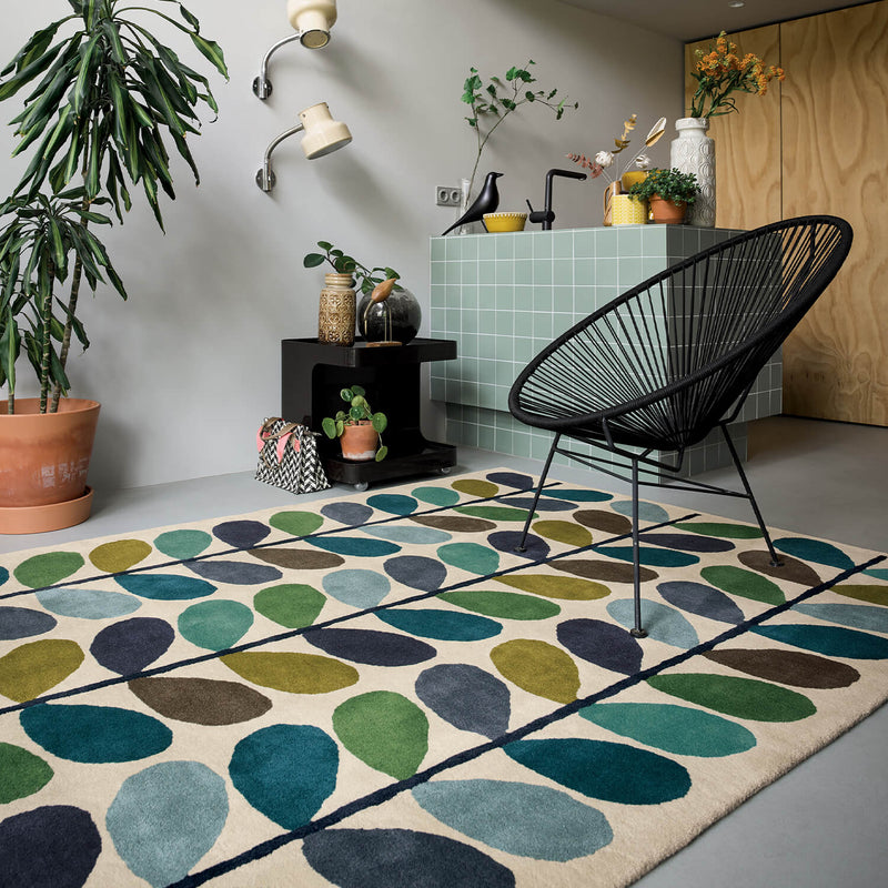 Plant filled home with an Orla Kiely Kingfisher Multi Stem Rug 