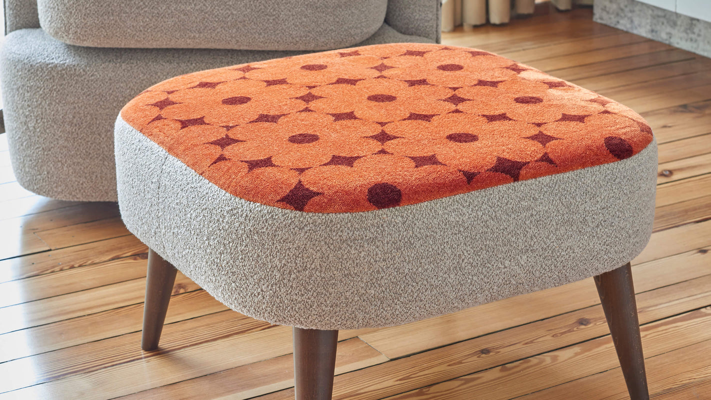 Lifestyle image of the Orla Kiely Leap Footstool in orange floral