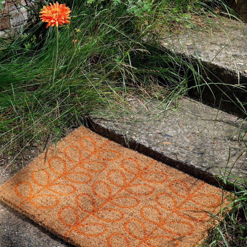 Lifestyle shot of the linear stem tomato outdoor Orla Kiely doormat