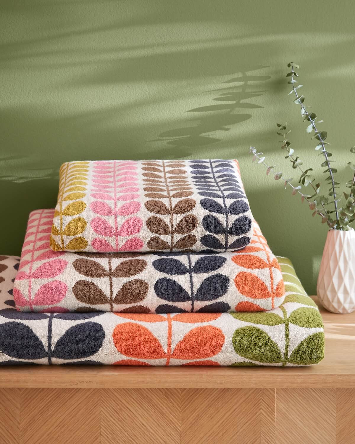 Lifestyle shot of Orla Kiely multi stem towels stacked