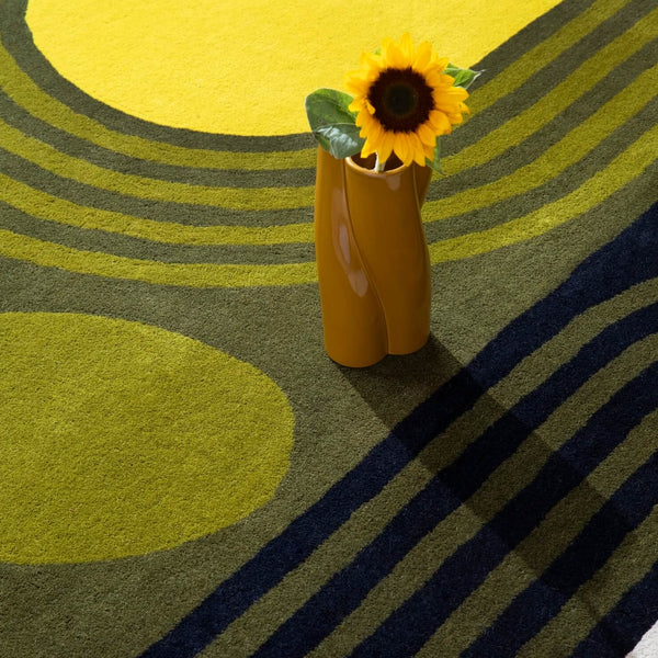Close up of Striped Tulip Seagrass Green Rug by Orla Kiely