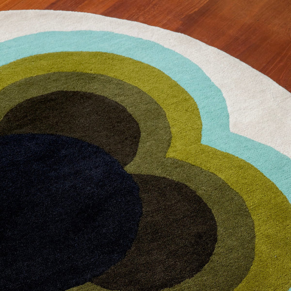 A close up of Orla Kiely's sunflower olive rug