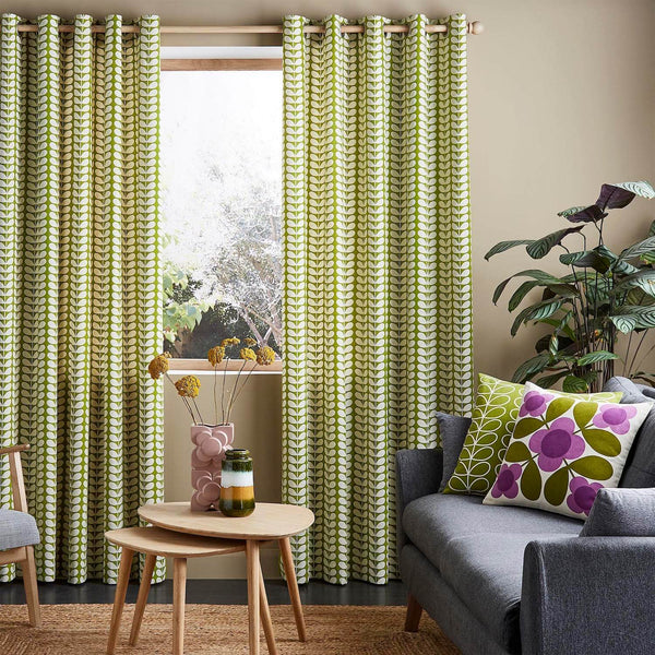 Lifestyle image of Orla Kiely solid stem pear curtains in living room