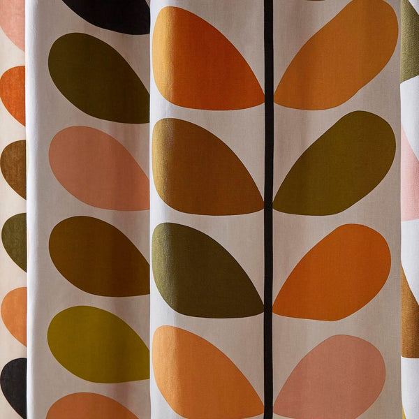Lifestyle close up image of Orla Kiely solid stem auburn curtains in living room
