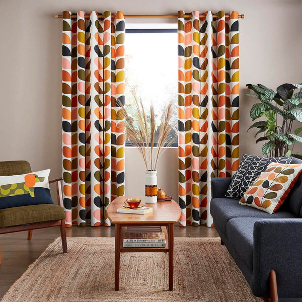 Lifestyle image of Orla Kiely solid stem auburn curtains in living room