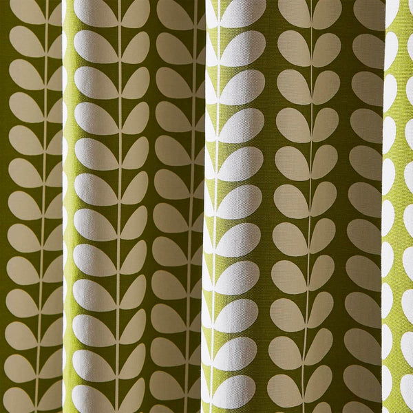Lifestyle close up image of Orla Kiely solid stem pear curtains in living room