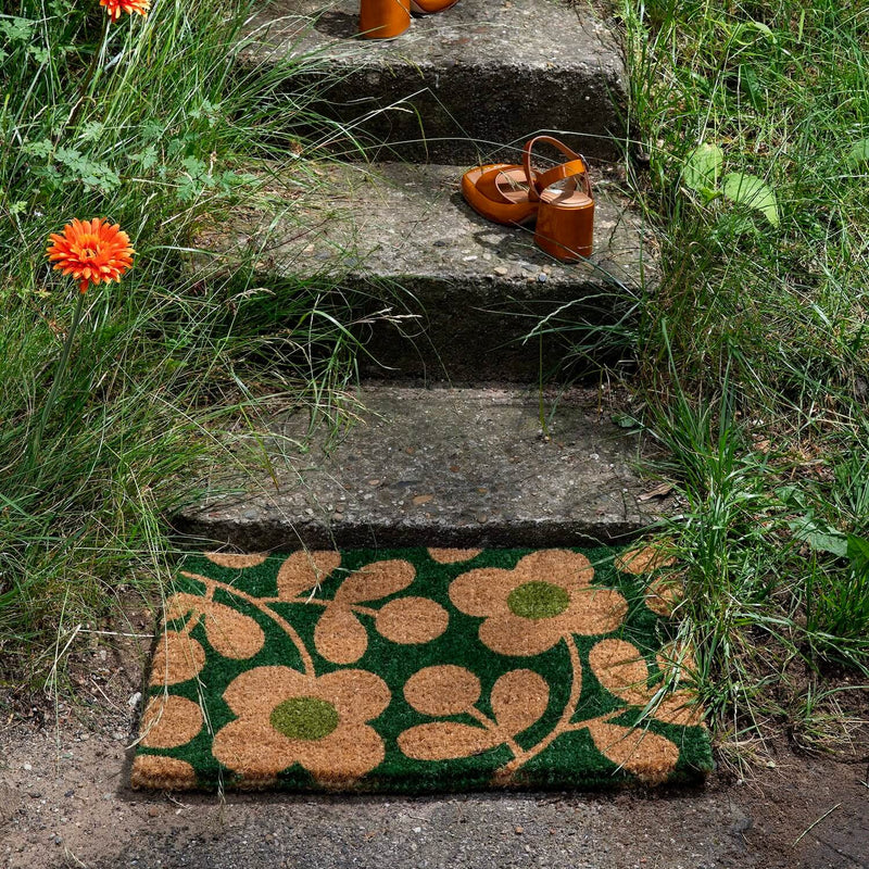 Lifestyle shot of outdoor Orla Kiely doormat in stem sprig emerald