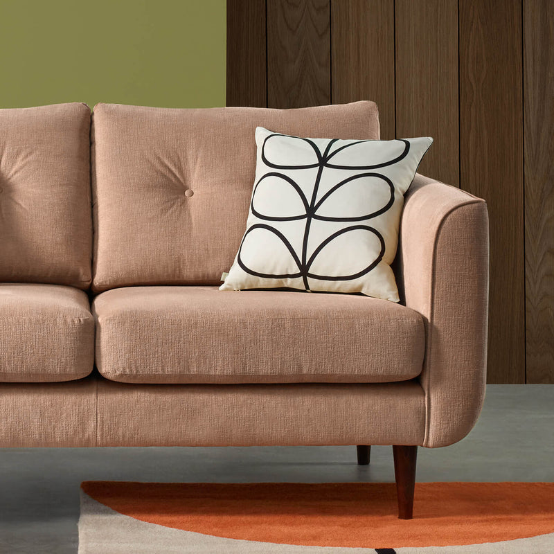 Linear Stem Orla Kiely cushion on pink sofa