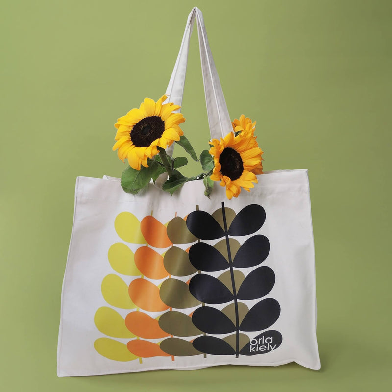 Orla Kiely Canvas Tote Bag holding sunflowers